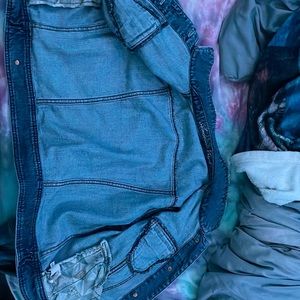 Jean jacket long sleeve with buttons and worn a good amount